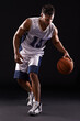 © Duncan M/peopleimages.com - Dribbling pro. Studio shot of a basketball player against a black background.