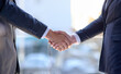 © Jadon Bester/peopleimages.com - First impressions go a long way in business. Shot of two unidentifiable businessmen shaking hands in the office.