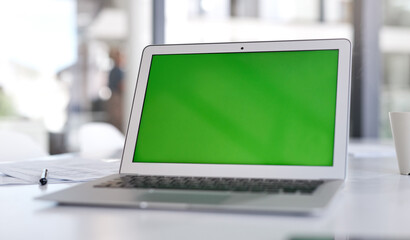Aufkleber - Make sure your landing page makes the loudest statement. Shot of a laptop with a green screen on a desk in a modern office.