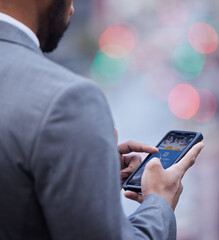 Poster - The company website is coming along well. Cropped shot of an unrecognisable businessman standing alone and using his cellphone.