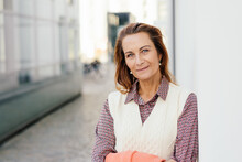 Outdoor Portrait Of Beautiful And Elegant Middle Age 55 - 60 Year Old Woman, Outside