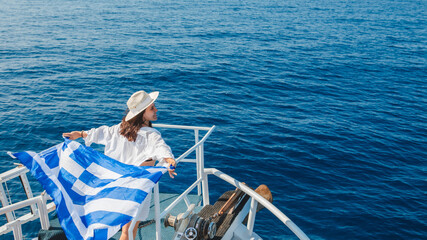 Poster - woman with greece flag at cruise boat lefkada island