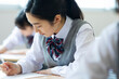 © amanaimages - テストを受ける女子高校生