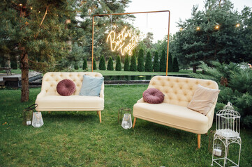 Cozy sofas for relaxing in the garden near the house on the grass. Relax and rest