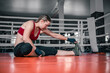 © andyborodaty - Young beautiful woman relax after fight or workout exercising in boxing ring