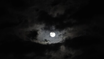Wall Mural - full moon moving between clouds, timelapse, 4k
