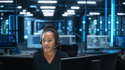 Fototapete - Female Executive Wears Headset Video Calling on Computer at Evening Office. Call Center Agent, Service Support Manager Speaking to Distance Customer in Webcam Chat. Helpline Concept