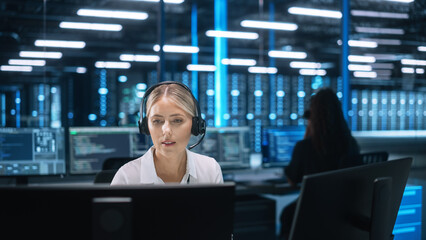 Fototapete - Confident Female Office Worker in Headset Video Calling at Computer During the Conference. Businesswoman Customer Service Manager Speaking to Webcam Communicating in Distance Remote Chat