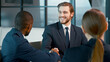 © AboutLife - Handshake of successful business people at a meeting in the office