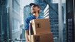 © Gorodenkoff - Young Delivery Person Riding Glass Elevator in Modern Office Building. Mail Courier Holding Cardboard Parcel Boxes. Handsome Mailman Delivering Fragile Packages in Business Center Lift.