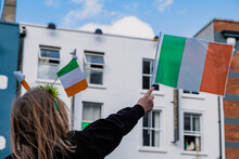 Irish Flag Between Held By A Girl, Saint Patrick Day Parade In Dublin, 2022
