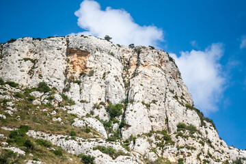 Wall Mural - Clouds over grassy hillside