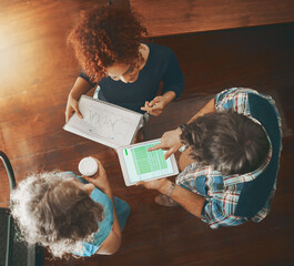 Strategising together to improve these stats. High angle shot of creative employees at work.