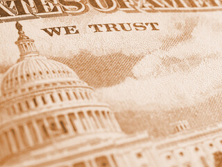 Wall Mural - American paper money background. Fragment of reverse of $50 bill showing the Capitol. US banknote closeup. Light brown tinted wallpaper. Public national debt and USA dollar. Bonds and treasurys. Macro