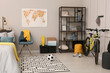 © New Africa - Stylish teenager's room interior with comfortable bed and sports equipment