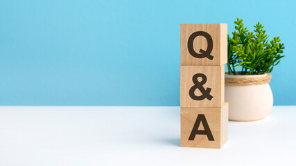 Poster - Q AND A - acronym from wooden blocks with letters, questions and answers. concept on grey background. copy space available