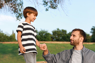 Sticker - Father holding his little son's hand outdoors