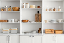 Shelf Unit With Clean Dishware In Kitchen
