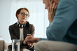 © Drazen - Caring therapist holding hands with her patient during mental health counseling.