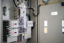 Control Panel With Circuit Breakers, Fuses, Rails, Wiring In The Distribution Board. Power Electric In Electrical Cabinet Control. Electricity And Electrical Maintenance Service.