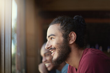 Sticker - Who doesnt love Fridays.... Shot of a group of laughing friends sitting at a table near a window.