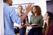 © Tasneem H/peopleimages.com - Theyre a team always encouraging each other to push further. Cropped shot of a team of designers having a meeting in an office.