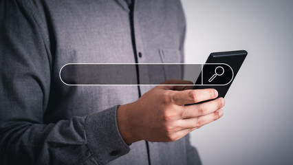 Wall Mural - close-up male hands using smartphone on gray empty space background. searching or social networks co