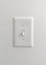 White Light Switch On Painted Wallpaper Wall