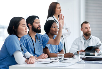 Poster - Asking probing questions about the problem. Shot of a doctor raising his hand during a meeting in a hospital boardroom.