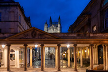 City Of Bath, UK. Night Sightseeing Of Bath Downtown With Abbey Church Of Saint Peter And Saint Paul Next To Restored In Victorian Times Ancient Roman Baths.