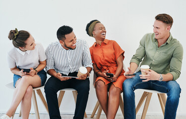 Sticker - We get along so well. Cropped shot of a diverse group of businesspeople sitting against a gray background together and using technology in the office.