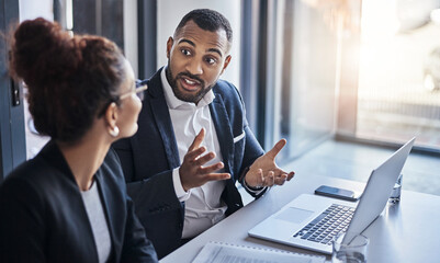 Aufkleber - This is how we will manage the plan. Shot of two businesspeople having a discussion in an office.