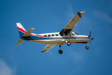 Cessna 208b Grand Caravan G-BZAH Light Aircraft Ascending From Take Off In A Clear Blue Sky