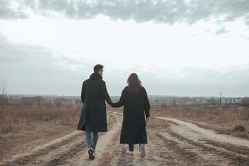 Young loving couple with coffee on ukrainian nature background