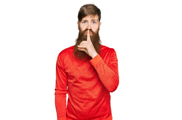 Canvas Print - Redhead man with long beard wearing casual clothes asking to be quiet with finger on lips. silence and secret concept.