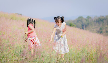 Poster - Cute happy children playing in Reeds of grass field