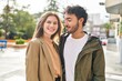 © Krakenimages.com - Man and woman smiling confident hugging each other at street