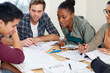 © Marius V/peopleimages.com - Theyre helping him study. Cropped shot of a group of university students in a study group.