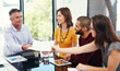© Thurstan H/peopleimages.com - Heres the paperwork you asked for. Cropped shot of a group of businesspeople in a meeting.