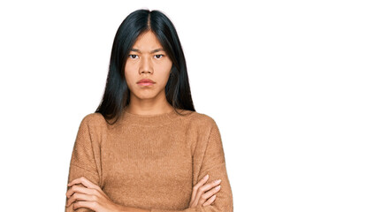 Poster - Beautiful young asian woman wearing casual winter sweater skeptic and nervous, disapproving expression on face with crossed arms. negative person.