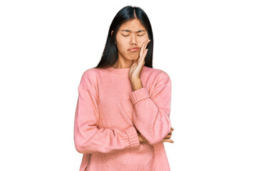 Sticker - Beautiful young asian woman wearing casual winter sweater touching mouth with hand with painful expression because of toothache or dental illness on teeth. dentist