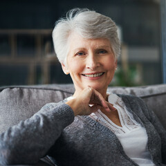 Sticker - Right here is where Im happiest. Portrait of a senior woman relaxing on the sofa at home.