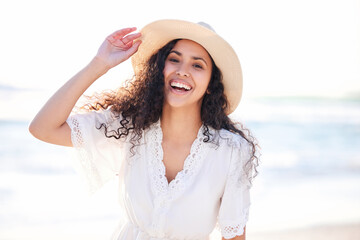 Poster - Beach days are happy days. Shot of a young woman enjoying a day at the beach.