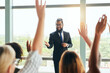 © Tamani C/peopleimages.com - Okay, question time.... Cropped shot of a handsome young businessman fielding questions from his colleagues during a seminar.