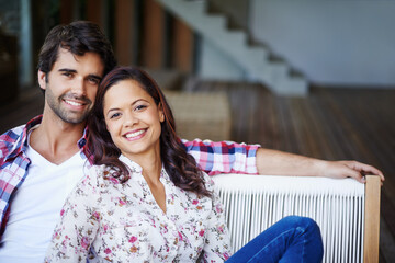 Poster - Relaxing together and enjoying the moment. A loving young couple spending time together at home.