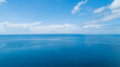 © Panya - Aerial view of a blue sea surface water texture background and sun reflections Aerial flying drone view Waves water surface texture on sunny tropical ocean in Phuket island Thailand