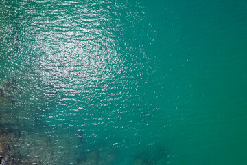 Poster - Sea surface aerial view,Bird eye view photo of blue waves and water surface texture Blue sea background Beautiful nature Amazing view