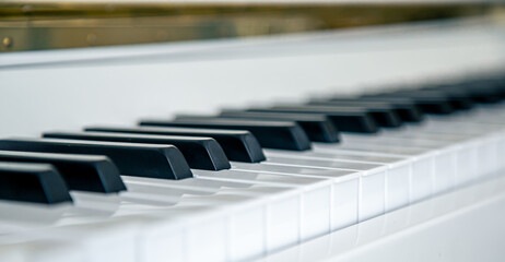 Wall Mural - Close-up of white piano keys, musical background.