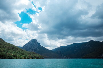 Wall Mural - Popular tourist attraction. beautiful nature view with fjord and mountains in the water. Artistic nature, copy space.