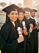 © Katleho Seisa/peopleimages.com - Its such a life-changing moment. Portrait of a group of students standing in a line on graduation day.